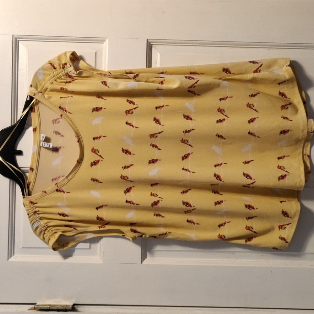 Yellow blouse with bird pattern